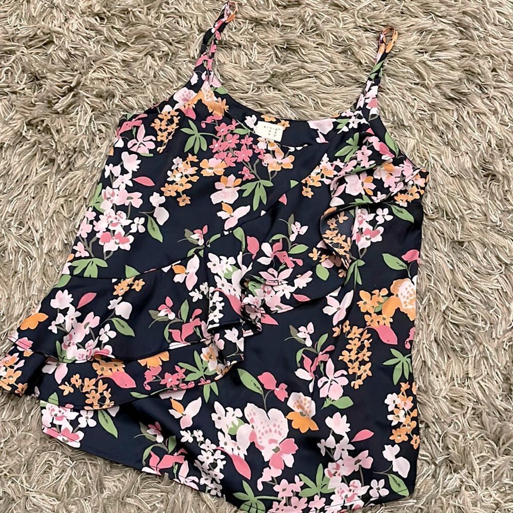 A New Day Floral Tank w/ruffle in front. Size XS